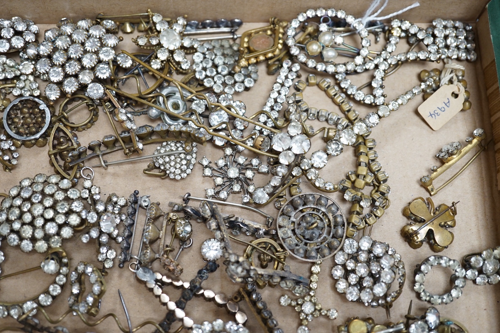 A quantity of assorted white paste jewellery, including brooches, hair ornament, etc.